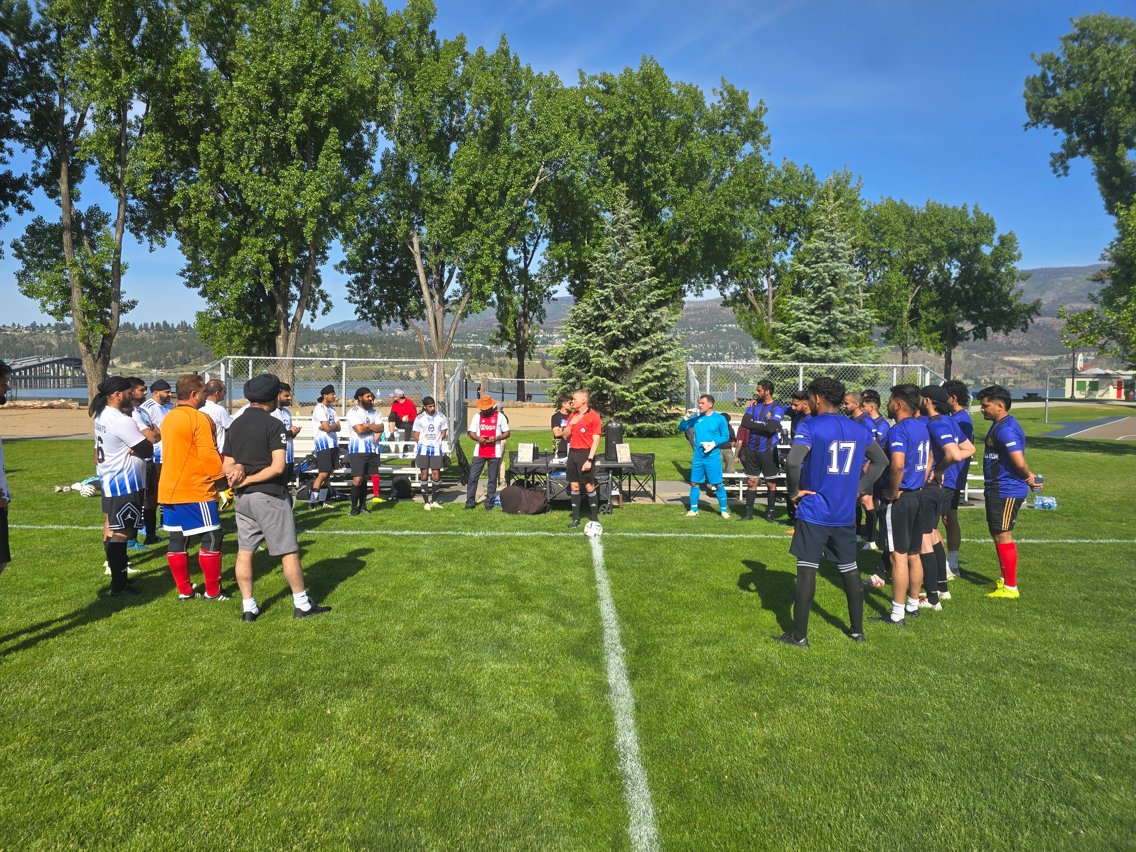OKGN Sports community members playing soccer at an Okanagan event